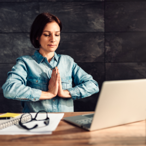 woman meditating at work